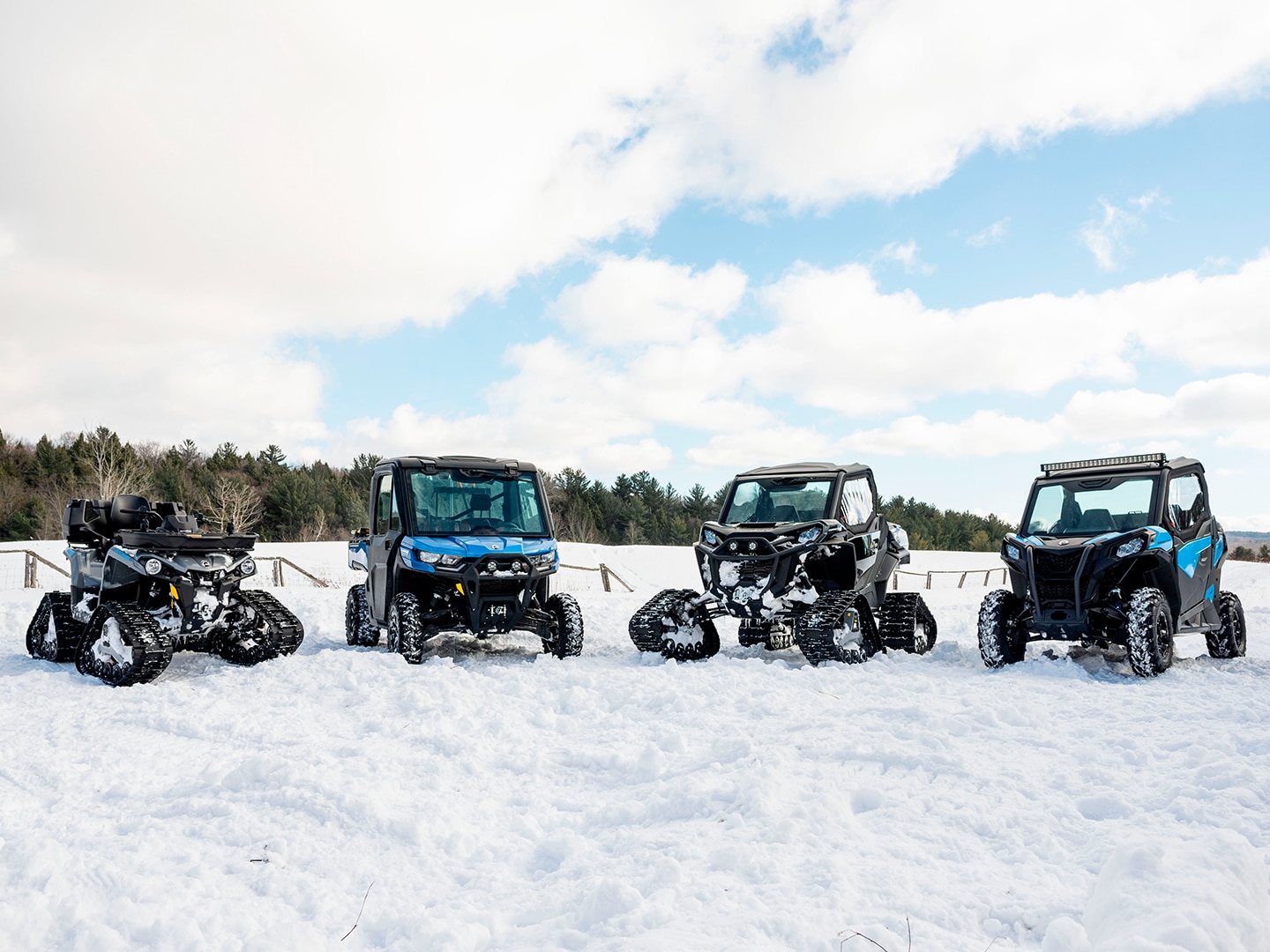Can-Am vehicles idling in the snow
