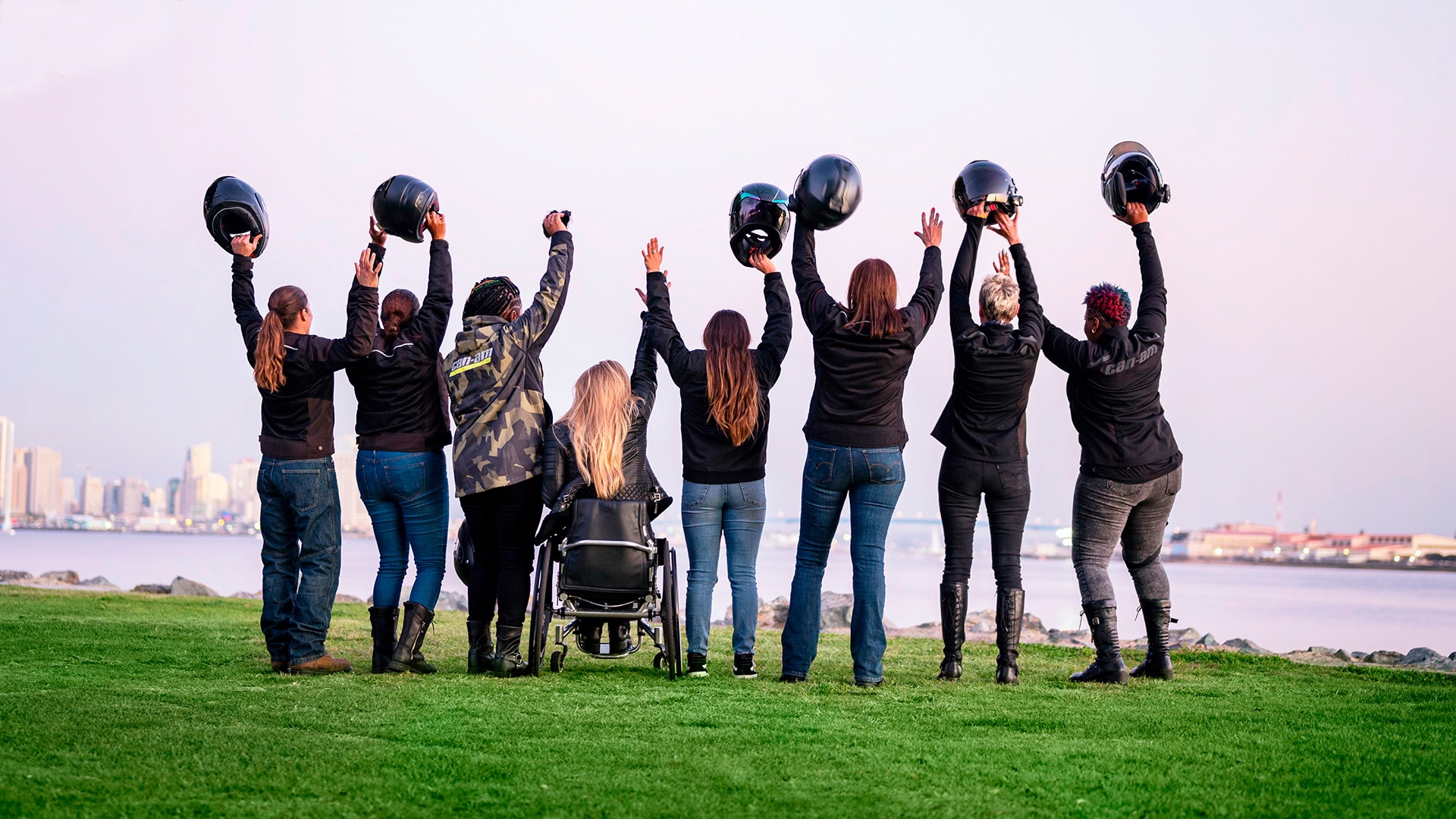 Women of On-Road with hands in the air