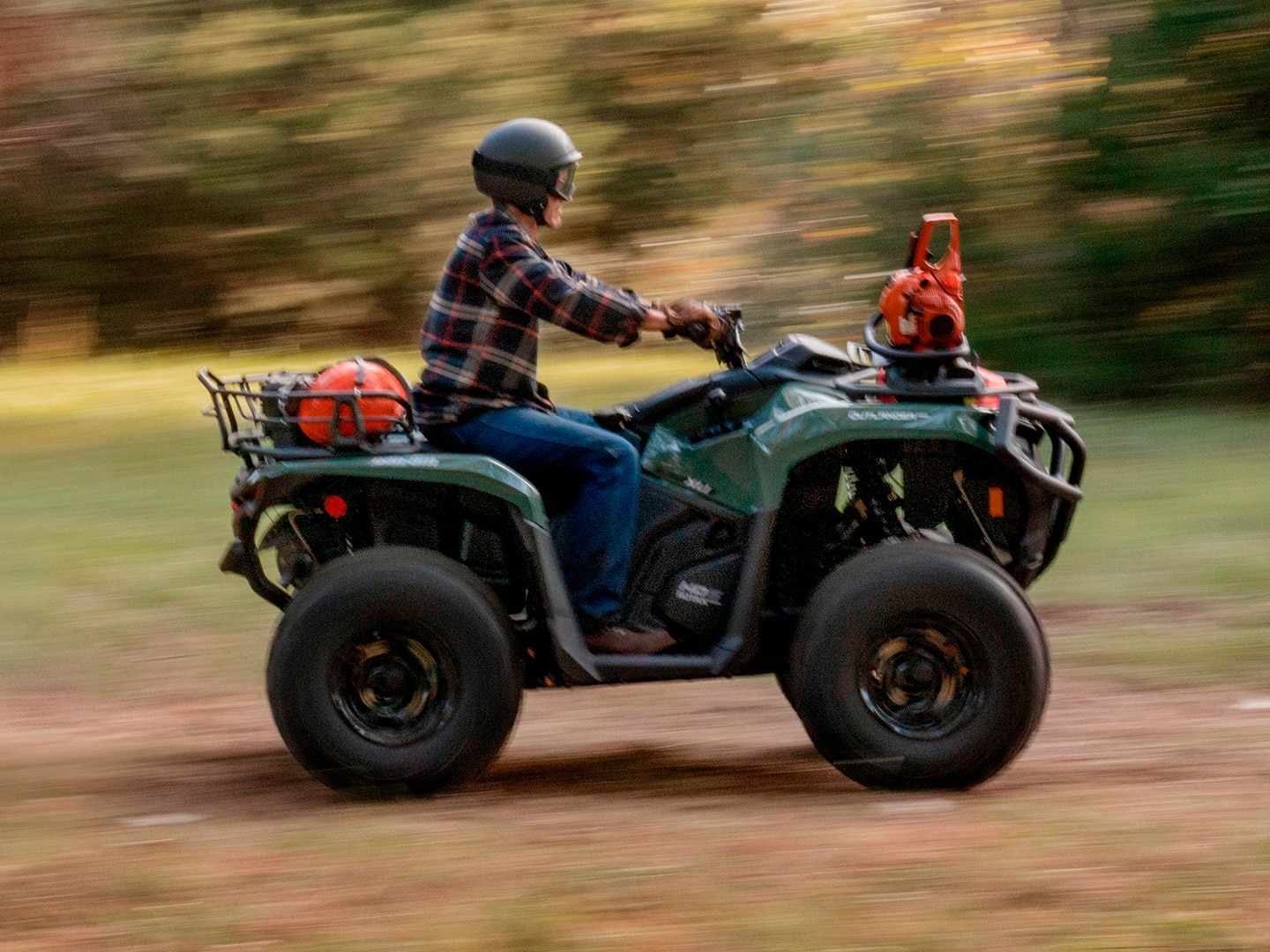Rider driving by on their Can-Am ATV
