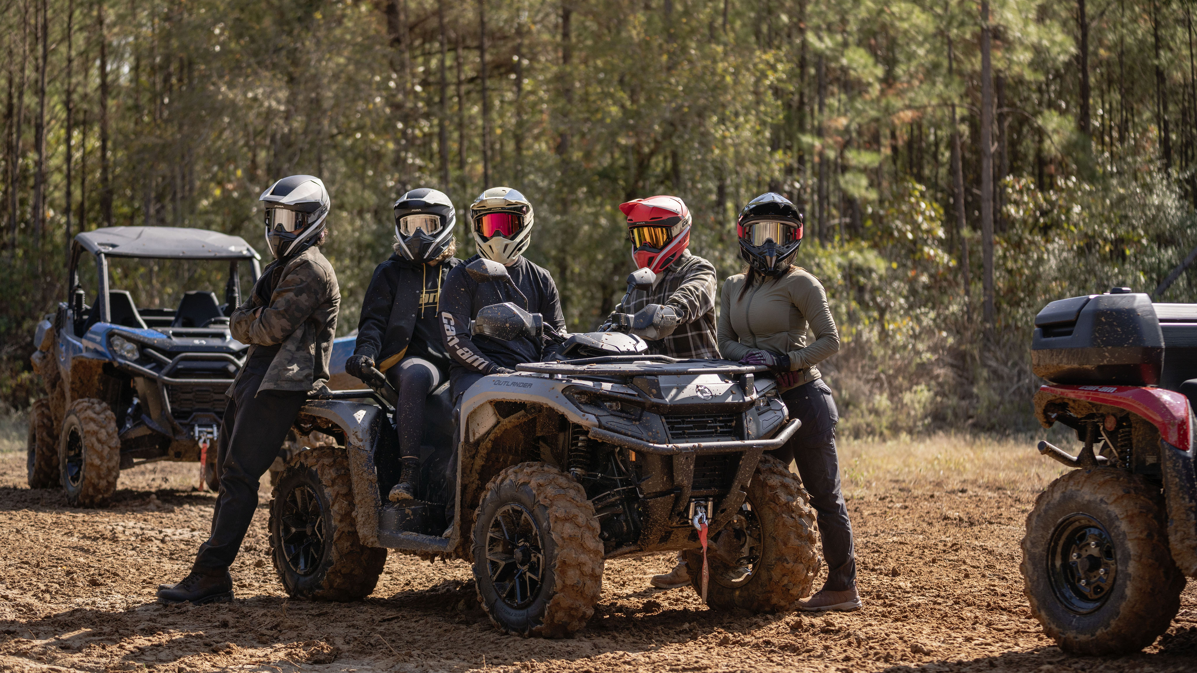 Group of friends next to their atv